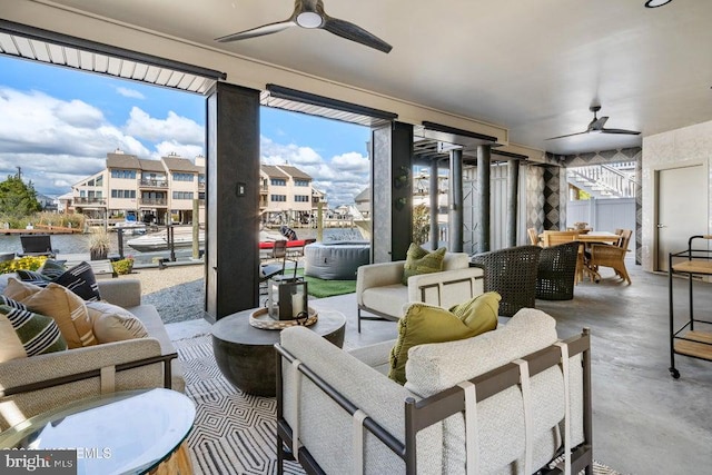 sunroom / solarium featuring ceiling fan