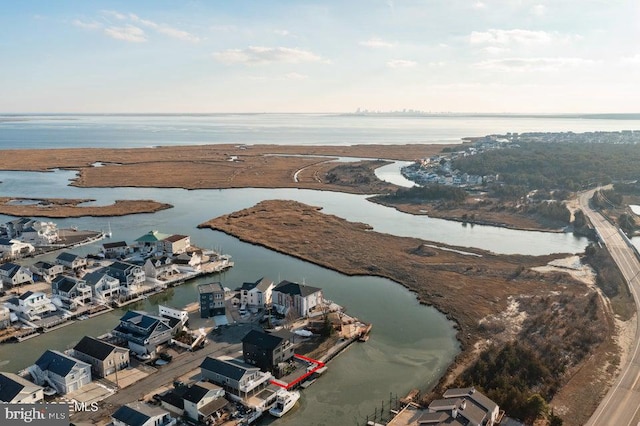 drone / aerial view featuring a water view