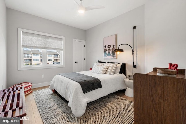 bedroom with hardwood / wood-style flooring and ceiling fan