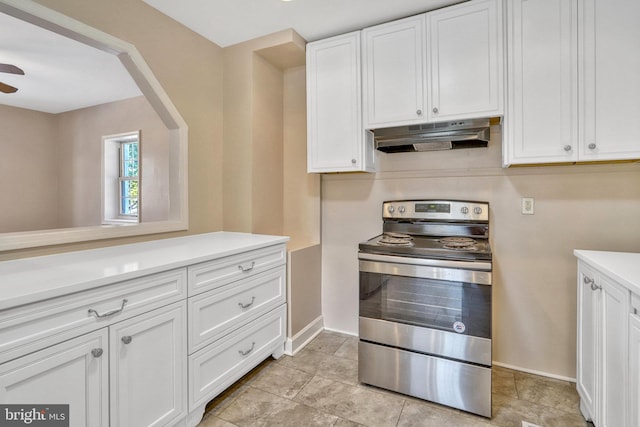 kitchen with white cabinetry, ceiling fan, and electric stove