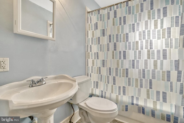 bathroom featuring sink and toilet