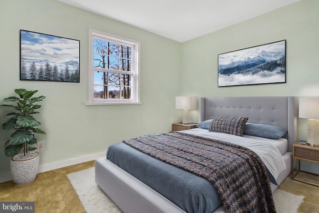 bedroom with light colored carpet