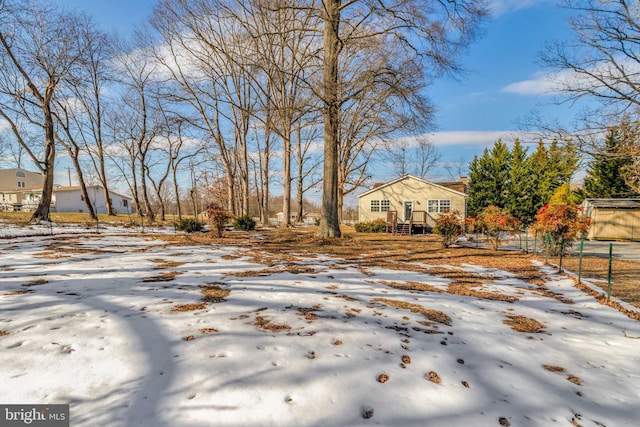 view of yard covered in snow