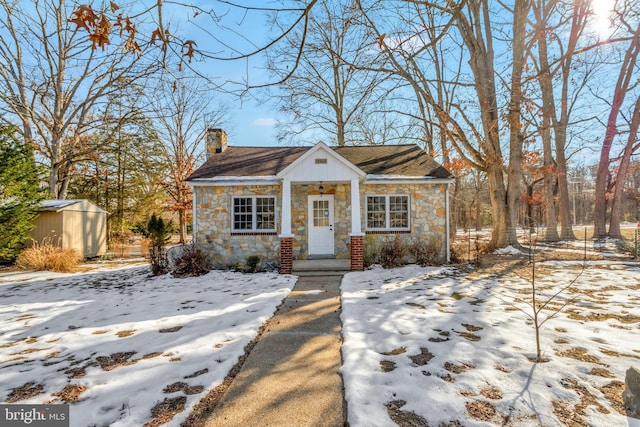 view of front of home with a storage unit