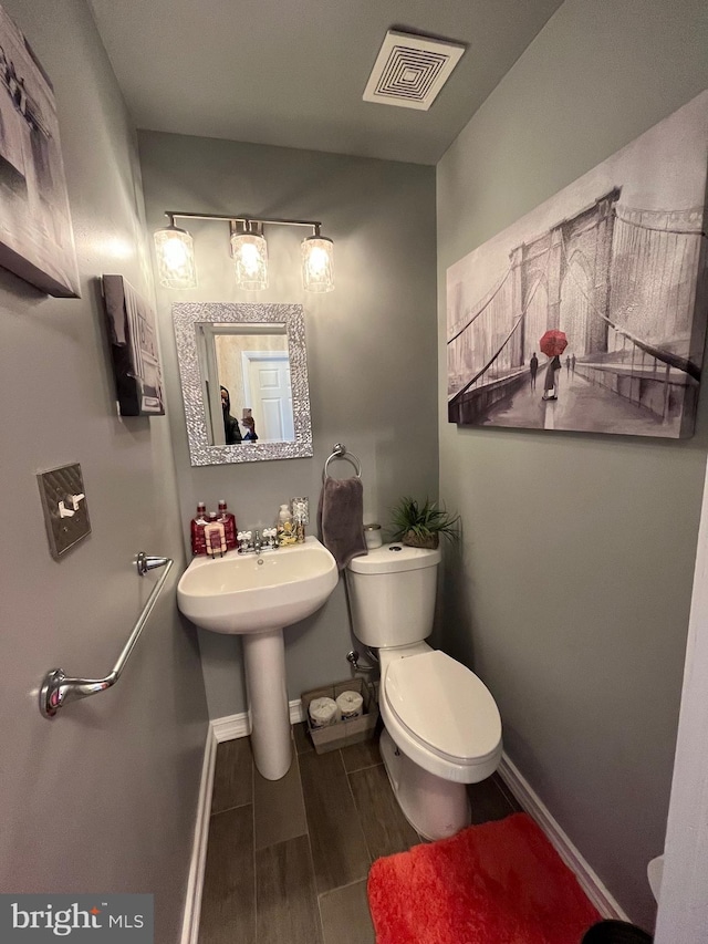 bathroom with toilet and sink