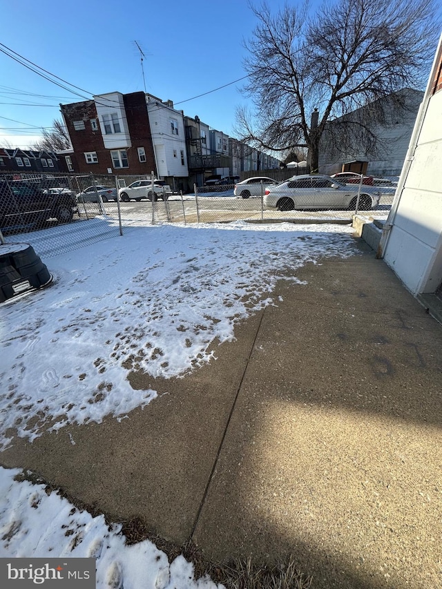 view of yard layered in snow