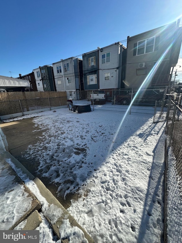 view of yard layered in snow