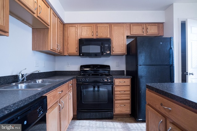 kitchen with sink and black appliances