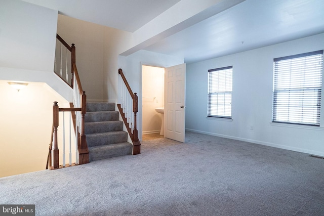 interior space featuring carpet