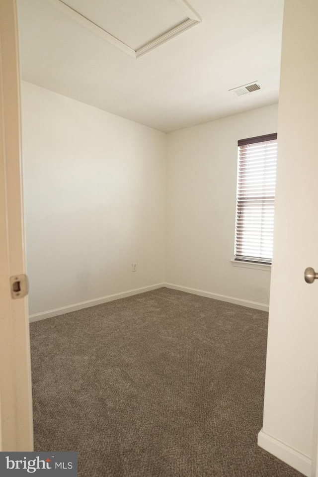 empty room with dark carpet