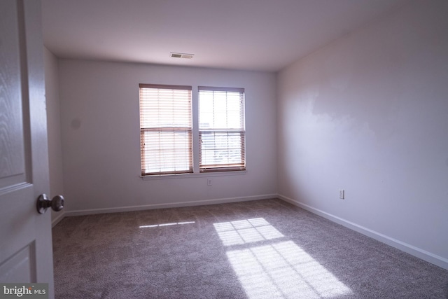 unfurnished room with carpet floors