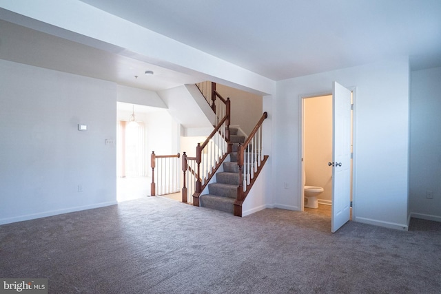 interior space with dark colored carpet