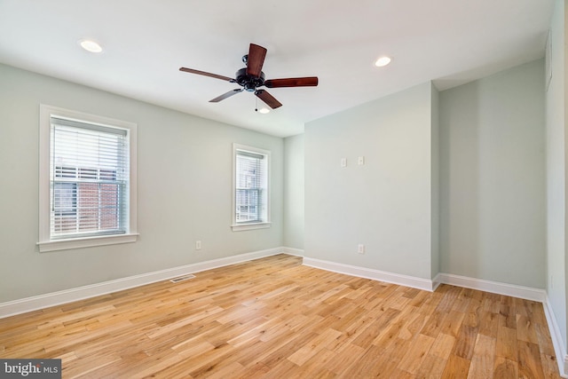 unfurnished room with light hardwood / wood-style flooring and ceiling fan