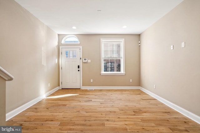 entrance foyer featuring light wood-type flooring