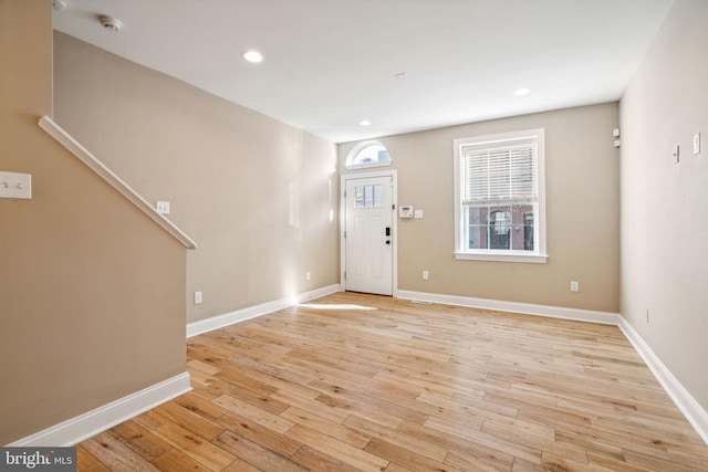 entrance foyer with light hardwood / wood-style floors