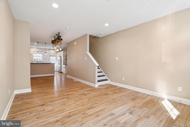 unfurnished living room with light hardwood / wood-style floors