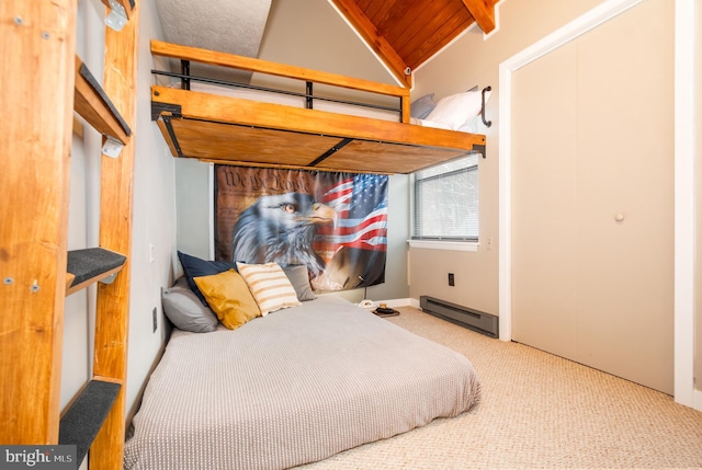 carpeted bedroom with baseboard heating, lofted ceiling, and wooden ceiling