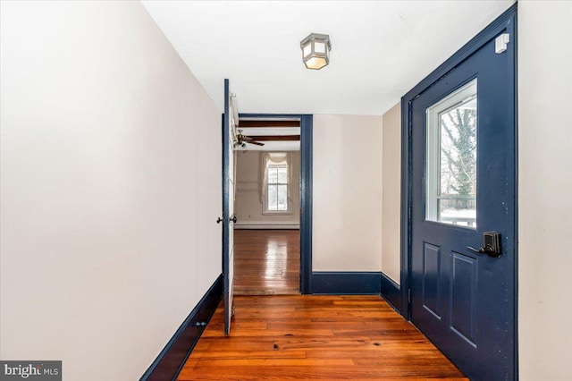 entrance foyer featuring dark hardwood / wood-style flooring and a baseboard heating unit