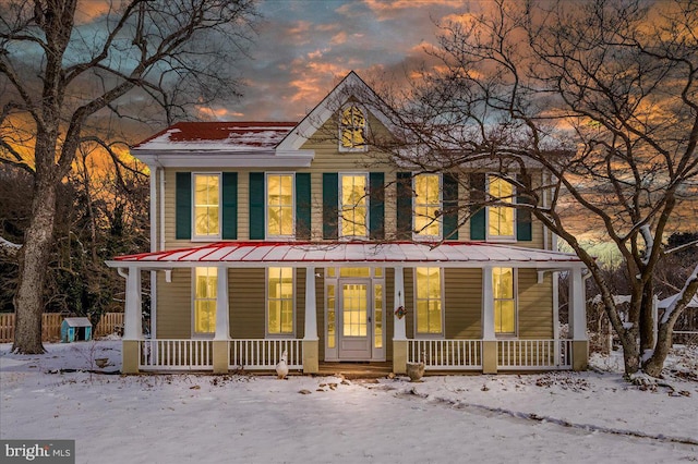 country-style home with a porch