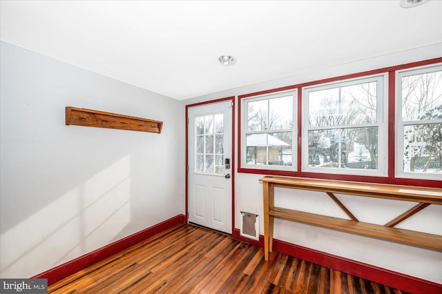 doorway featuring dark hardwood / wood-style floors