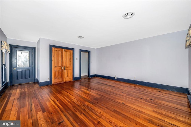 interior space with dark hardwood / wood-style flooring