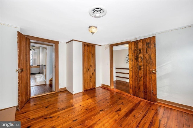 interior space with hardwood / wood-style floors