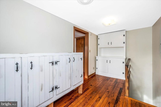 hall with dark hardwood / wood-style floors