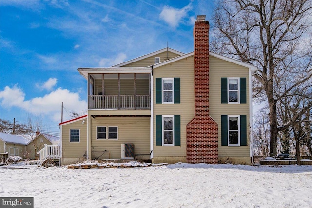 view of snow covered house