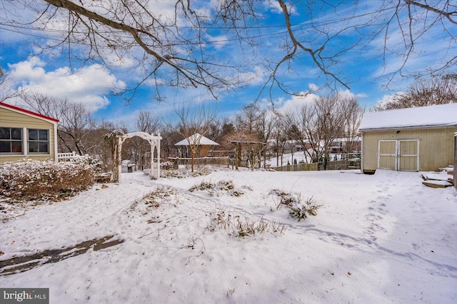 view of yard layered in snow