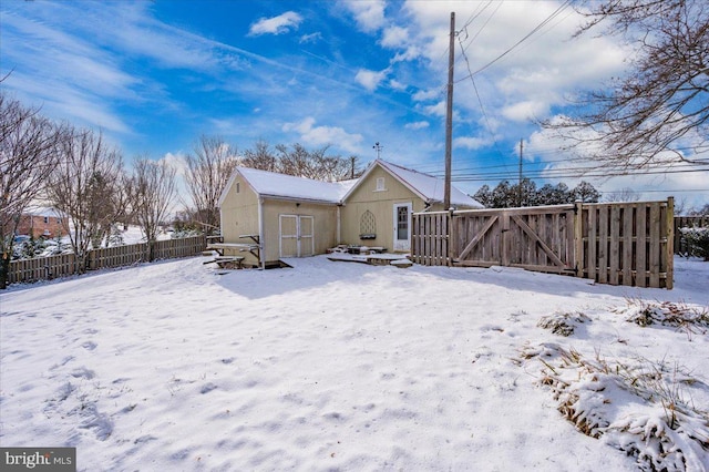 view of snow covered house