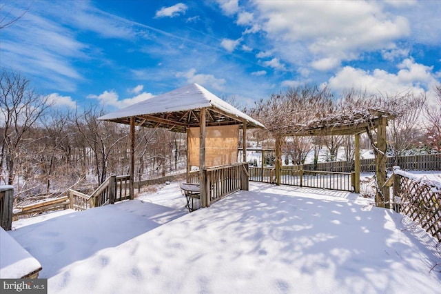 yard covered in snow with a gazebo