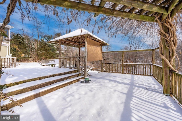 snow covered deck featuring a gazebo