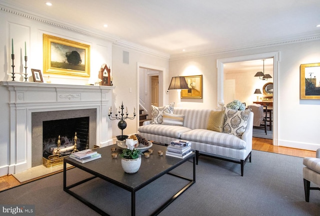 living room with hardwood / wood-style floors and crown molding