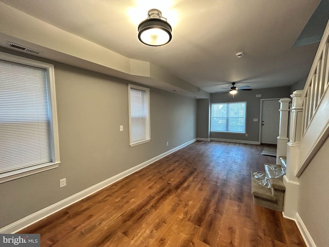 interior space with dark hardwood / wood-style floors and ceiling fan