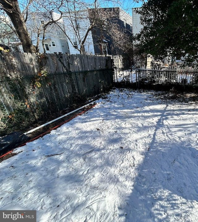 view of yard covered in snow