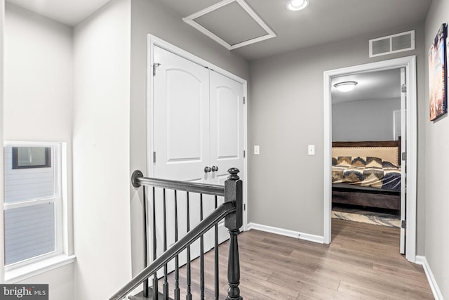 hallway with light wood-type flooring