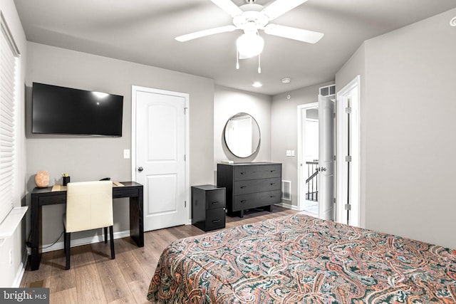 bedroom with ceiling fan and light hardwood / wood-style flooring