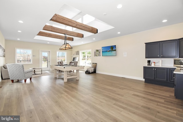 game room with light wood-type flooring