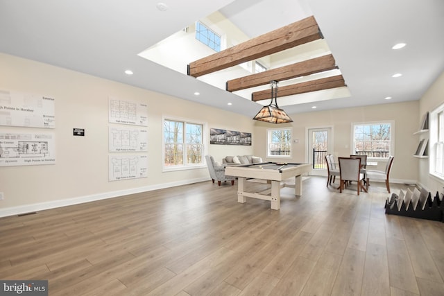 recreation room with hardwood / wood-style flooring, billiards, beamed ceiling, and a wealth of natural light