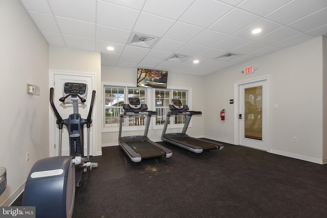 workout area with a drop ceiling