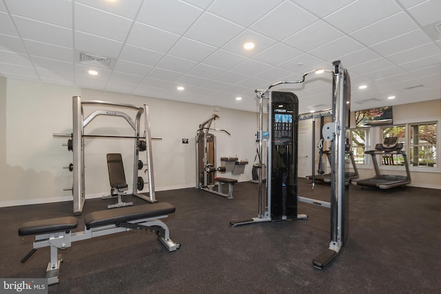 exercise room featuring a paneled ceiling