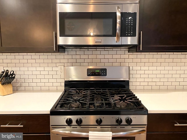 kitchen with decorative backsplash, dark brown cabinets, and stainless steel appliances