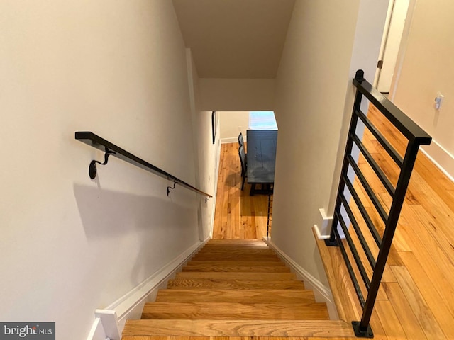 staircase featuring hardwood / wood-style floors