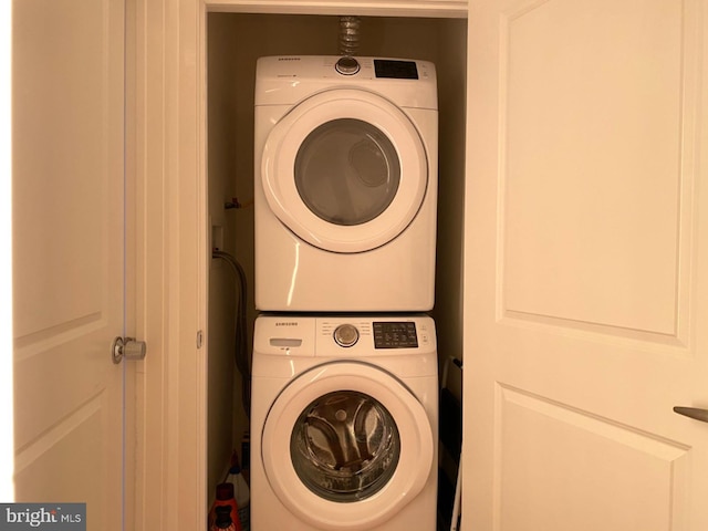 laundry room featuring stacked washing maching and dryer