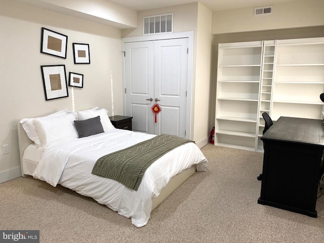 carpeted bedroom featuring a closet