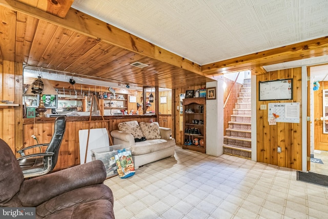 living room featuring wood walls