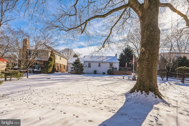 view of yard layered in snow