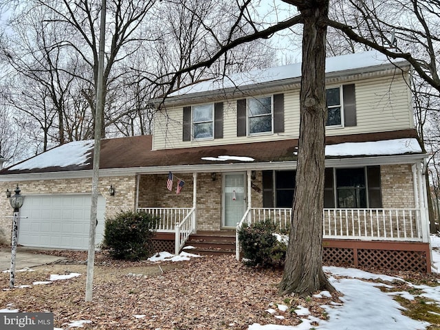 view of front of home featuring a garage and covered porch