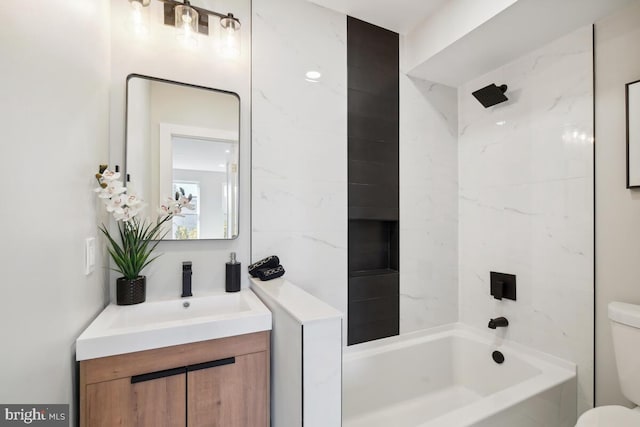 full bathroom featuring bathtub / shower combination, toilet, and vanity