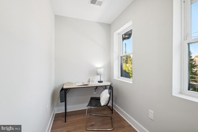 home office with wood-type flooring